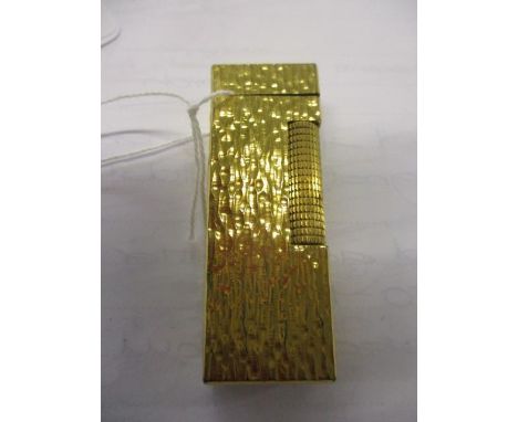 A gold plated Dunhill lighter 