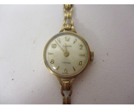 A Slava ladies manual wind 9ct gold wristwatch.  The dial having Arabic numerals and inscribed Slava 17, jewels total weight,