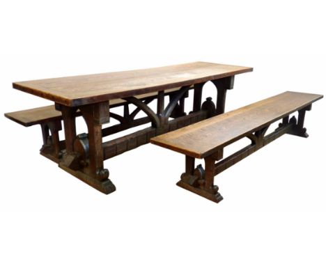 Mid 19th century oak refectory table and two matching benches, the table with two plank cleated top support on heavy gothic d