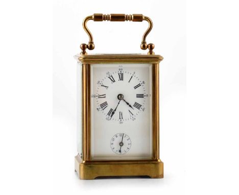 A 19th century small French carriage clock with brass case and white enamel face with Roman numerals and subsidiary dial. Sin