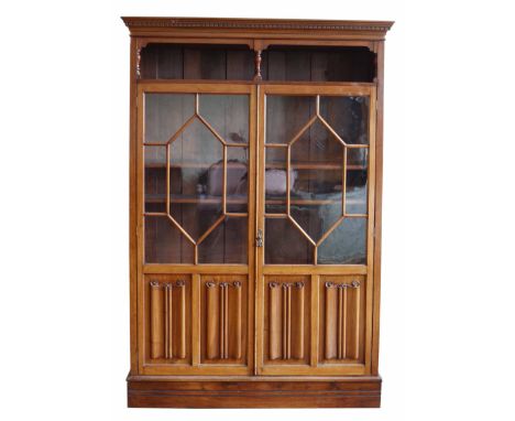 Edwardian mahogany glazed bookcase, top section with dentil cornice, open shelf, two astragal glazed doors with linen fold pa