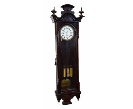 Vienna regulator with stained beech case and white enamel dial framed with gilt work. Three-train movement. With brass weight