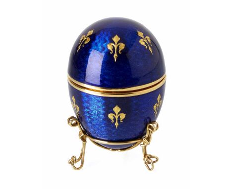 A Faberge Egg presentation trinket box by Victor Meyer (workmaster). 18ct gold and royal blue guilloche enamel with 18ct gold