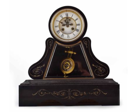 19th century slate mantel clock. White enamel dial with Roman numerals and open-escapement. A glass panels reveals the gridir