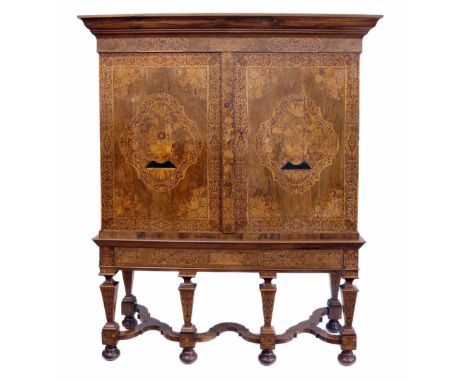 Late 18th century continental walnut side cabinet, ogee mould above two doors, each inlaid with marquetry baskets of flowers 