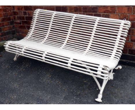 Late 19th century cast and wrought metal garden bench, later wrought metal seat standing on cast pedestal base with animal pa