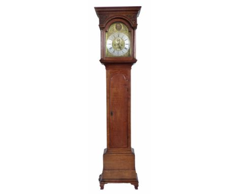 An 18th century long-case clock, by William Lowndes of Salop. Oak case with Doric columns supporting a canopy with blind fret