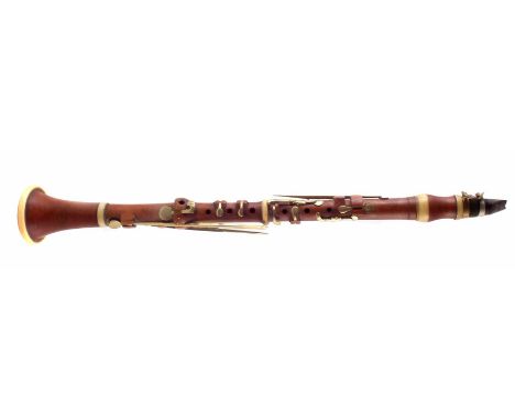 Boxwood clarinet by T. Prowse, of four sections with ivory mounts and brass keys, stamped 'T. Prowse Hanway Street, London', 