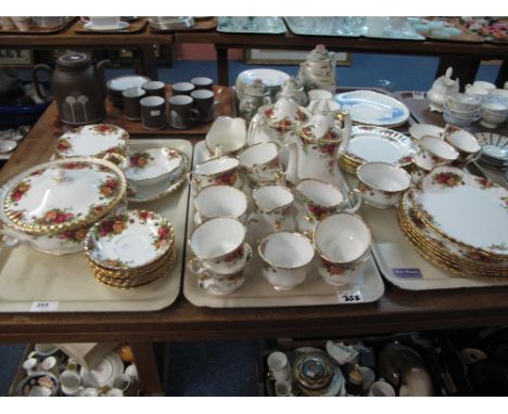 Three trays of Royal Albert bone china, old country roses, part tea and dinner ware items comprising cups, saucers, various p