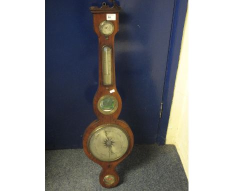 19th century rosewood wheel barometer with broken swan neck pediment and silvered dial. Unnamed.