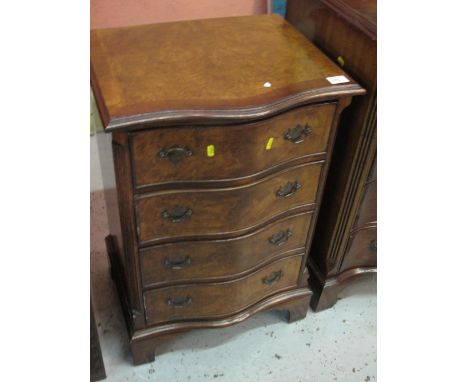 Small reproduction walnut cross banded serpentine fronted chest of four drawers on bracket feet. CONDITION REPORT: Light wear