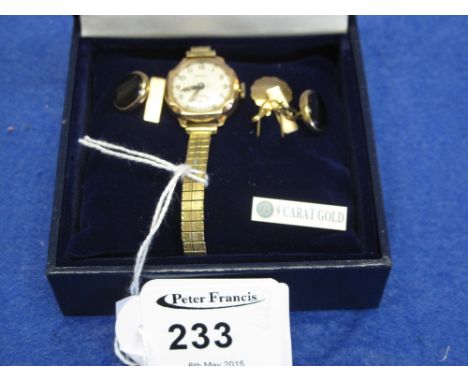 Nine carat gold lady's Rotary wrist watch and a pair of nine carat gold cufflinks with pendant.