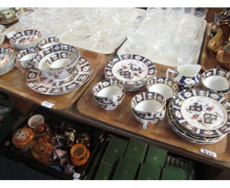 Two trays of Imari design china, part tea ware items comprising cups, saucers, various plates, bowls, sucrier, milk jug etc. 