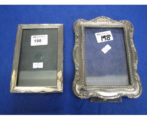Plain silver rectangular photograph frame and a similar foliate scrolled gadroon photograph frame (2) CONDITION REPORT: Clear