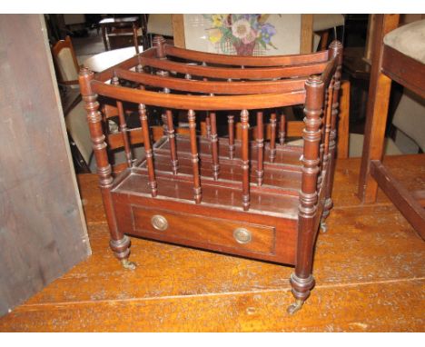 19th Century mahogany music canterbury on baluster turned legs with brass cups and castors.