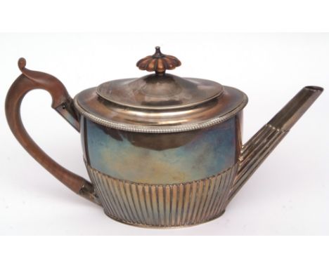 George III oval tea pot of half-fluted form with hinged and domed cover and treen handle and finial, width 28cm, weight appro