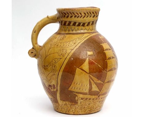Interesting globular jug decorated in ochre slip with a nautical scene of a galleon with flags and a frieze of fish below, th