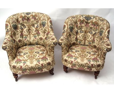 Pair of Victorian tub type armchairs, well upholstered in floral print with birds, foliage etc, raised on ring turned front s