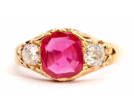 Ruby and diamond ring, the oval shaped ruby 0.83ct approx, flanked by two old cushion cut diamonds, diamond weight 0.48ct app