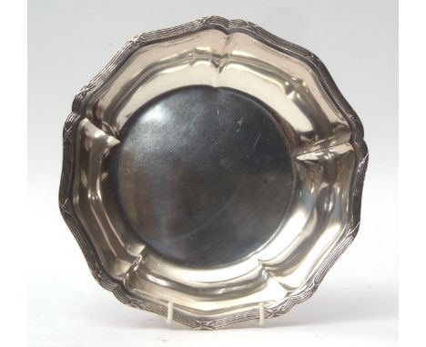 Swiss white metal basin of shaped circular form with reeded and ribbon border and polished field, diam 24cms, weight approx 4