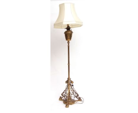 Victorian brass oil standard lamp, (now converted to electricity), plain reservoir and adjustable shaft with tripod base, 140
