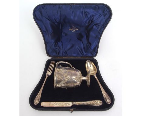 Cased Victorian parcel gilt christening set comprising a christening mug with beaded border and polished body with embossed a