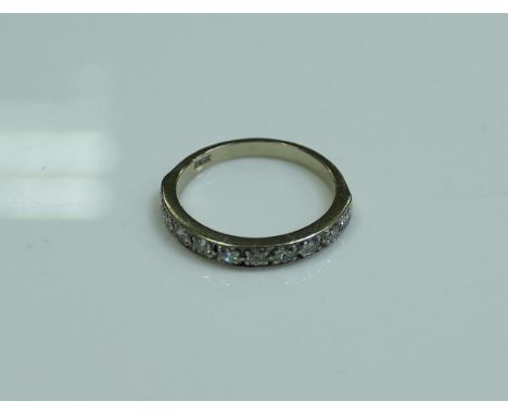 An 18 carat white gold and diamond set half eternity ring, size P, 0.3 carat total, 2.6 g 