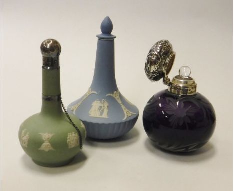 A Wedgwood Green Jasperware gourd shaped scent bottle, together with a Wedgwood Blue Jasperware dressing table scent bottle a