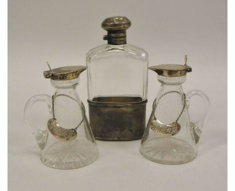 A pair of conical glass Whisky tots with silver mounts (Birmingham 1919) with two silver Whisky labels and a silver mounted c