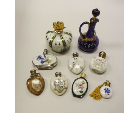 A collection of seven various printed and painted decorated scent bottles, three of heart design, together with a Limoges dre