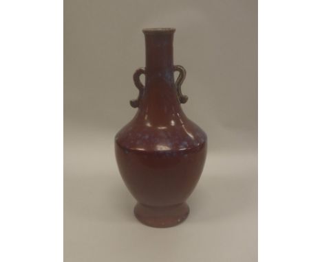 A Chinese sang de boeuf glazed twin handled vase bearing faux Daoguang seal mark to base, 42 cm high CONDITION REPORTS Minor 