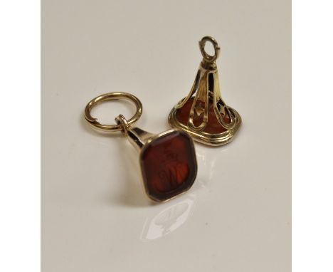 A pair of 19th Century gold (un-marked) Carnelian seals, one of rectangular form with canted corners, one depicting a dragon'