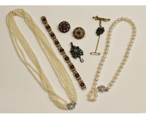 A modern five strand pearl necklace with silver clasp in the form of a flower set with pearl to centre, 52 cm long, together 