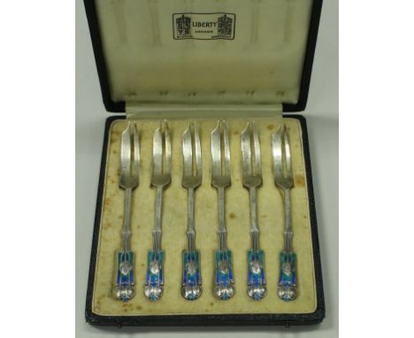 A set of six George V silver and turquoise enamel decorated cake forks in the Art Nouveau taste, designed by Archibald Knox f