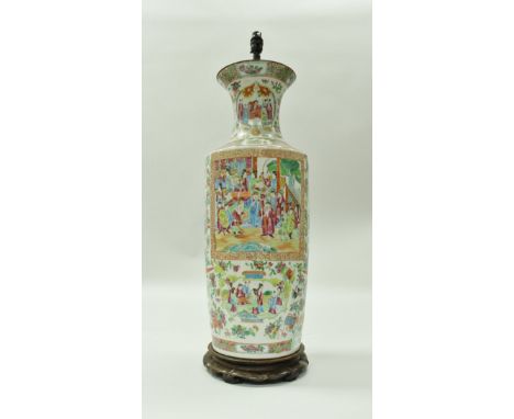 A 19th Century Chinese Canton famille-rose vase in typical palette, the main body decorated with panels of figures within a g