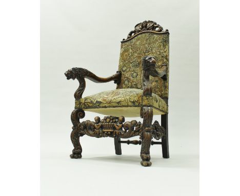 A late 19th Century walnut framed hall chair in the circa 1700 Flemish manner, the top rail carved with scrolling acanthus an