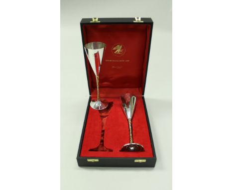 A pair of Stuart Devlin parcel gilt silver goblets, the tapering bowls raised on textured stems to a spread circular base, ea