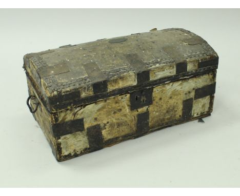A 19th Century dome top trunk hide covered and iron bound, bears brass plaque to top inscribed "Blackall", opening to reveal 
