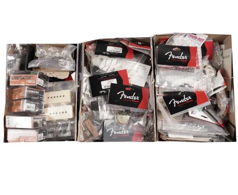 A large quantity of Fender and other guitar parts including pots, pickup mounts, toggle switches, capacitors, strap locks, sc