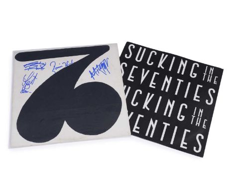 A Rolling Stones vinyl album, Sucking In The Seventies, signed by members of the group.