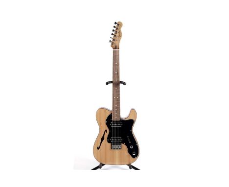 A T-style Thinline guitar with Fender Mexico neck, bound mahogany body with spruce top, fitted with two TV Jones pickups.