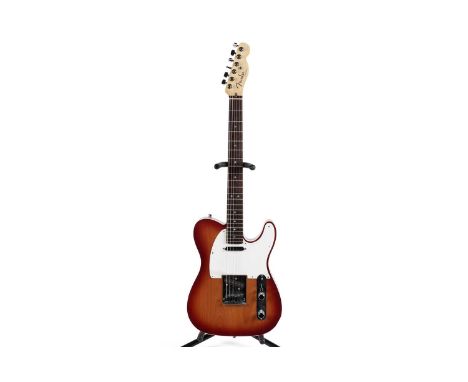 A Fender USA Telecaster Deluxe, serial number DZ93xxxx2, rosewood fretboard, locking tuners, cherry sunburst finish, in Fende