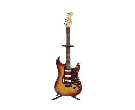 A 2004 Fender USA Deluxe Ash Stratocaster serial number DZ3xxxx42, with locking tuners, rosewood bound neck, abalone dot mark