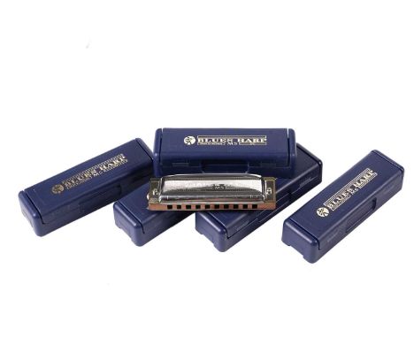 Five Hohner Blues harp harmonicas, two in F, two in G, and another in D, cased. (5)