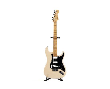 A Fender Deluxe Stratocaster serial number DZ4xxxxx4, with maple neck, butterscotch finished body, interchanged pickups, Fend