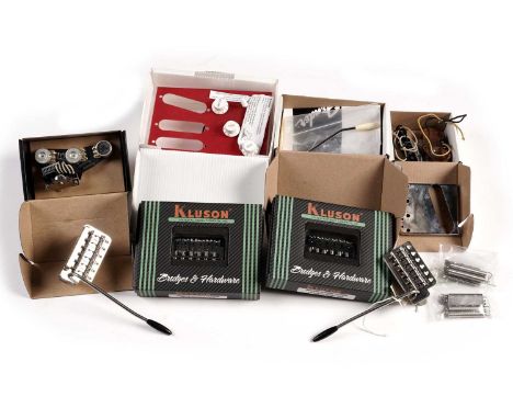 A quantity of guitar parts, comprising: two Kluson Strat hardtail bridges, boxed; an Obsidian Wire Strat switch plate; Strat 
