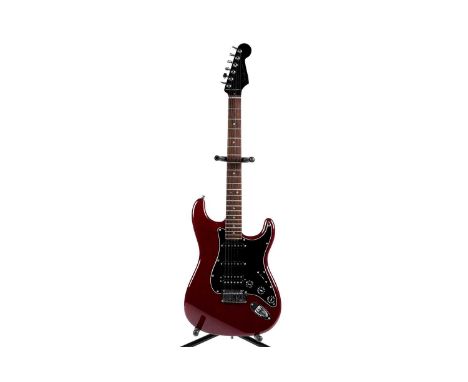 A Fender USA Designer HSS Stratocaster, serial number DZ6xxxx97, with cherry finished mahogany body, rosewood and maple neck,