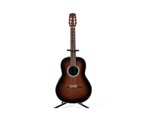 An Ovation AE133 Applause electro-acoustic guitar, made in Korea. with deep bowl back, sunburst finish, nylon strung.