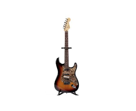 A Fender USA Deluxe Stratocaster, serial number DZ7xxxx48, sunburst finish with paisley custom scratchplate, locking tuners a