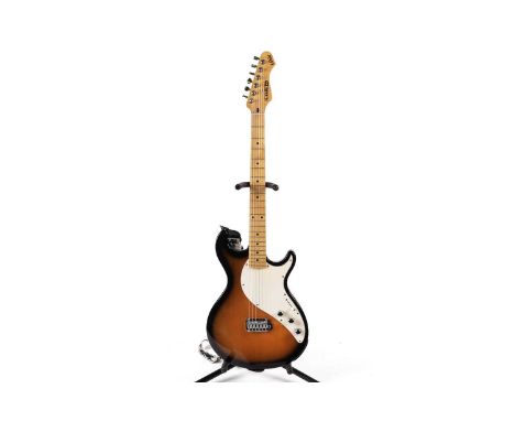 A Line 6 Variax modelling guitar, with maple neck, two-colour sunburst body, tremolo, and padded case.